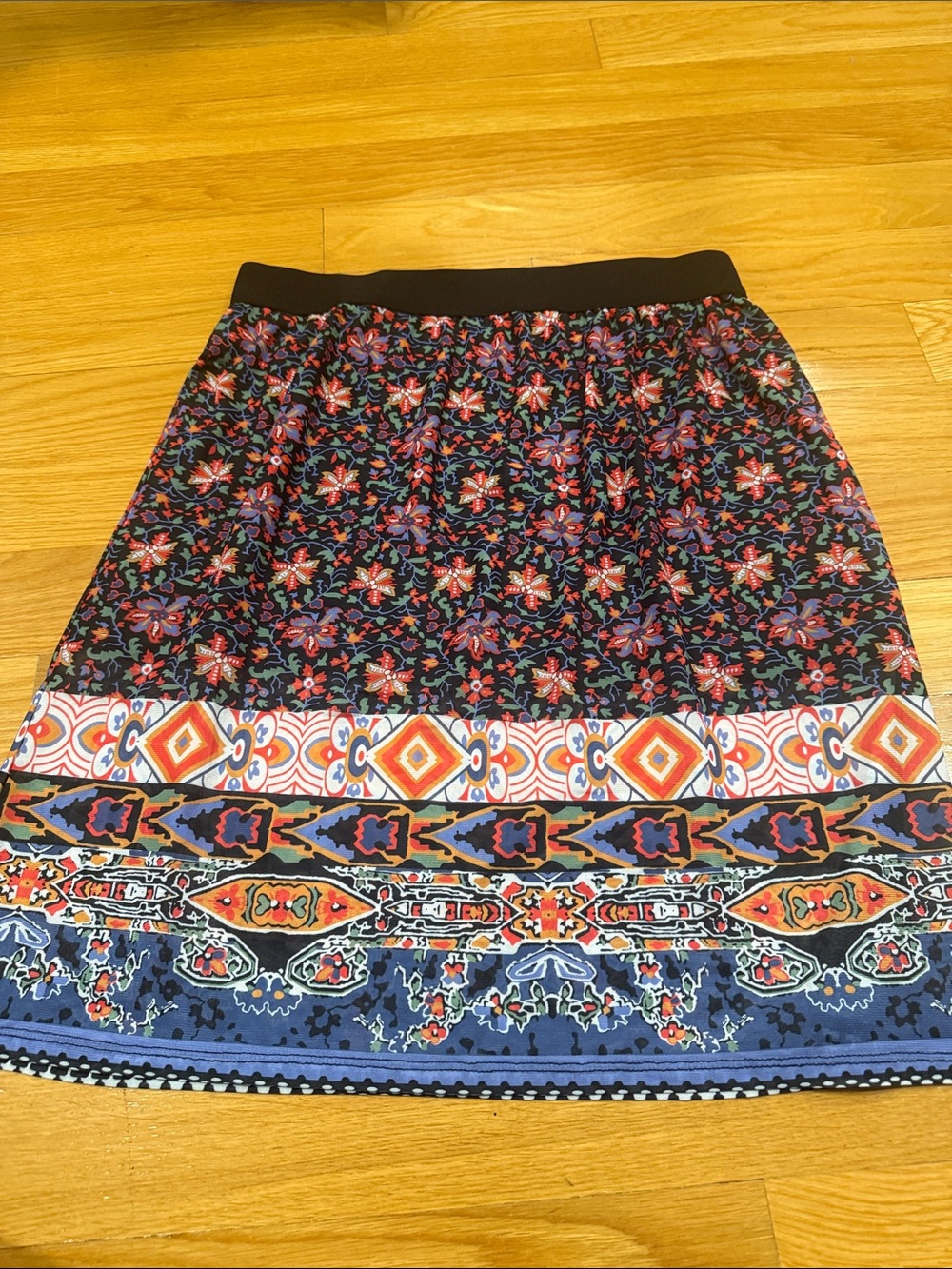 NWT San Francisco women’s midi skirt with multicolored pattern size medium.